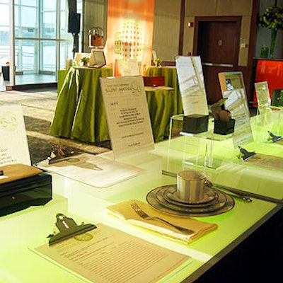 The lots in the silent auction sat atop green underlit tables.