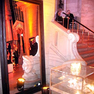 Full-length wood-framed mirrors around the room reflected the white light of spinning disco balls.