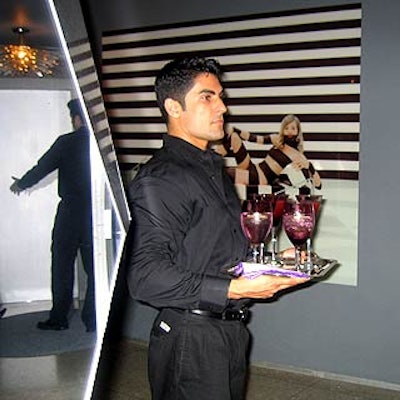 A server offered drinks at a cocktail party launching Colin Cowie's new home line for J.C. Penney at Cowie's Greenwich Village apartment.