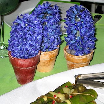 Hyacinths and tulips in tiny terra cotta pots peppered the tabletops for extra color.