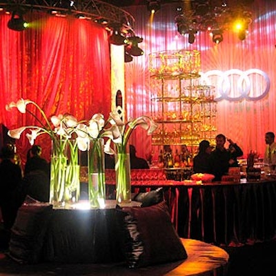 Audi filled the Hammerstein Ballroom with four red fabric-draped areas for its Never Follow event. Two circular bars in the center of the room featured multitiered shelves dripping with teardrop-shaped glass ornaments. White calla lilies decorated the circular seating areas.