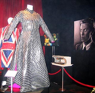 Stage costumes borrowed from the Rock and Roll Hall of Fame, flat-screen monitors that played music videos and portraits filled the room dedicated to David Bowie.