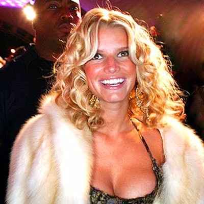 Hostess Jessica Simpson arrived at the launch party for her Dessert beauty line at Marquee on a pink carpet.