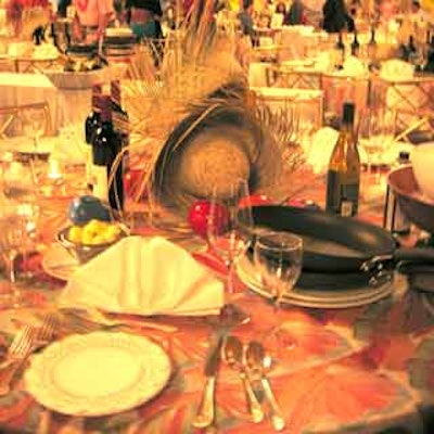 Atlas Floral Decorators Inc. dressed tables with colorful linens, straw hats and maracas, as well as chef hats and aprons for the interactive dinner portion of the Miami Wine & Food Festival.