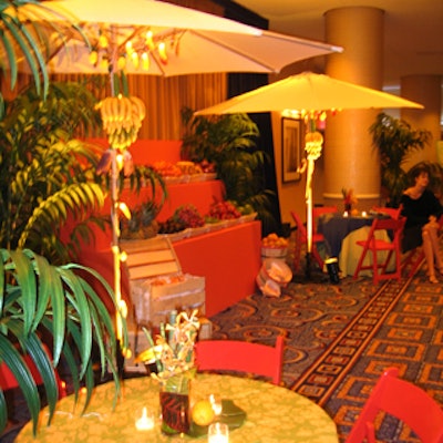 Overland Entertainment decorated the sixth floor ballroom lobby with ferns, brightly colored tablecloths, outdoor umbrellas and crates of fruit.