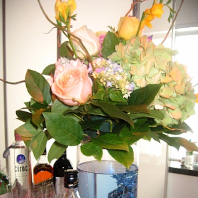 Flower arrangements were bright and spring-like mixes in vases containing colored water and Mylar garlands.