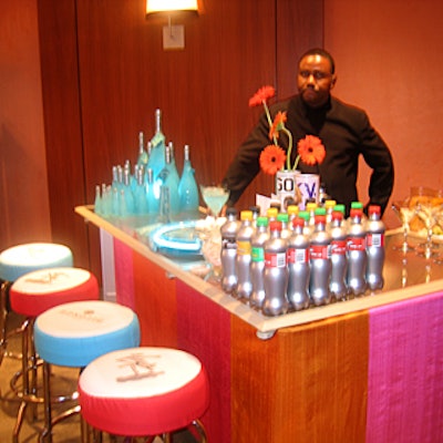 A bartender offered beverages including fruit-infused vodka cocktails from sponsor Hypnotiq.