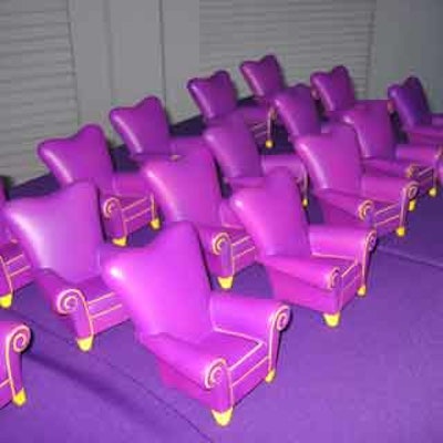 Mini versions of the big chair were used as decor and were also given to attendees as take-home gifts.