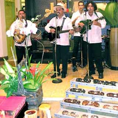 Latin Fever Productions played salsa songs at the Eddie Rodriguez store opening at Dadeland Mall.