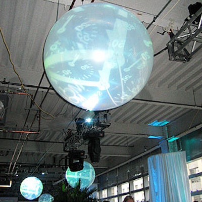 Van Wyck & Van Wyck projected images of watches onto weather balloons suspended from the ceiling.