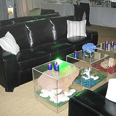 More lounge seating included black couches paired with Lucite tables.