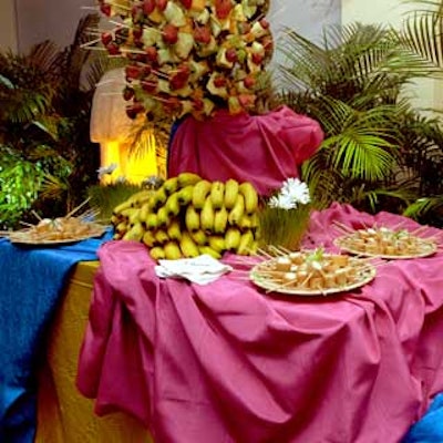 Skewered fruit stuck into pineapples did double duty as decor and dessert.