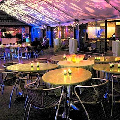 Tables in the lounge that flanked the dance floor were arranged in a flower pattern to mimic the flower projections on the ceiling of the tent.