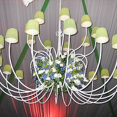Three large chandeliers from Frost Lighting, with dyed green lamp shades, dominated the center of the ballroom.