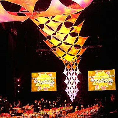 In the main ballroom, two giant video screens flanked a bright tensile fabric structure by Pink Inc. that crept up the front wall and across the ceiling over guests' heads.