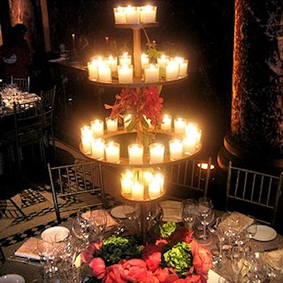 Experiential Agency creative director Dyan Garza chose candelabras that echoed the chandeliers at Cipriani 42nd Street and decorated the bases with bunches of peonies with hydrangea and hosta leaves.