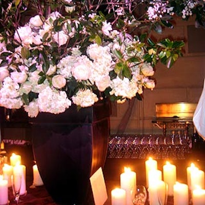 Chestnuts in the Tuileries' large arrangements of white roses, peonies, and hydrangeas decorated the bars while smaller bouquets sat on Lucite cubes.