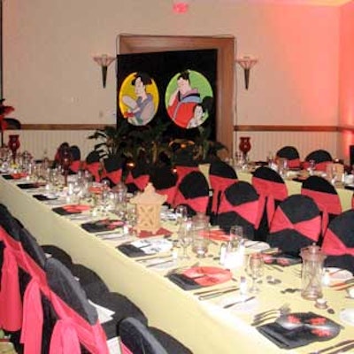 Guests sat at long tables bedecked with Asian-inspired goodies including fans, black river rocks and lanterns.