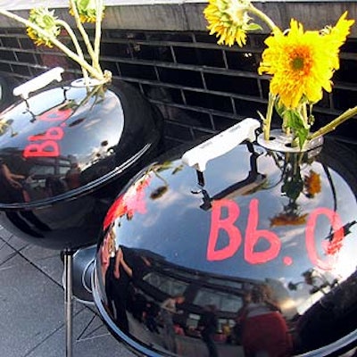 Sunflowers stuck out from the vents of three logo-painted Weber grills at the launch of Bumble & Bumble's new salon in the meatpacking district.