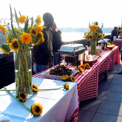 Red and white checked linens and abundant sunflowers brightened the salon's terrace.