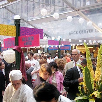 Strings of mini lanterns and colorful signs designed by the Rockwell Group filled the tasting area beneath a clear tent from Party Line.