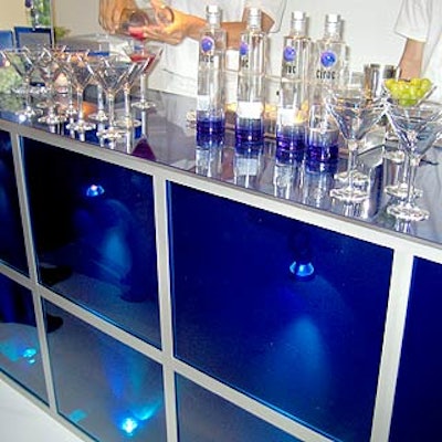 Martini glasses were always filled atop the unique blue geometric bars, which were illuminated from inside.