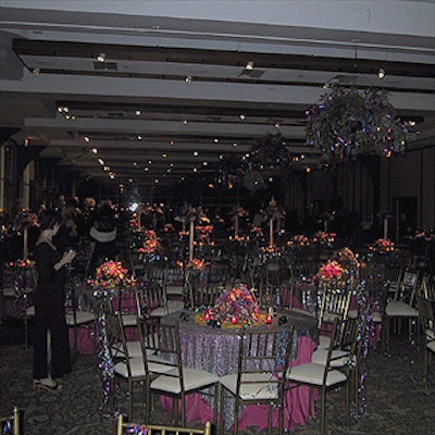Planners from Tobak-Dantchik Events & Promotions worked with Susan Edgar Design to fill Pier Sixty at Chelsea Piers with colorful flower arrangements and metallic ribbons.