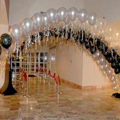Guests entered NACE's prom night event through an arch of balloons.
