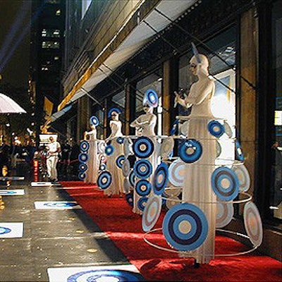 Outside the Fashion Targets Breast Cancer benefit at Saks Fifth Avenue, stiltwalkers hired by Karin Bacon Events performed for shoppers. Costume designer Mirena Rada incorporated the charity's logo into the performers' costumes. (Photo by Marty Cooper)