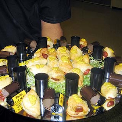At Metropolis and Interface Inc.'s screening of the new film The Corporation, Gourmet Gal served film-inspired fare including pigs in a blanket surrounded by rolls of Kodak film.
