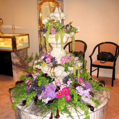 At Kaufmann de Suisse's launch event of its Cascade diamond collection, Matthew David Events displayed jewels among flowers that filled the store's marble fountain.