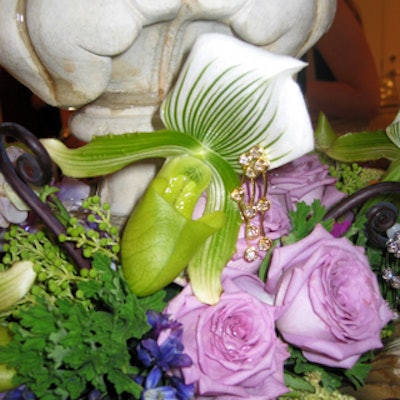 Matthew David Events clipped earrings to ladyslipper orchids inside the fountain.