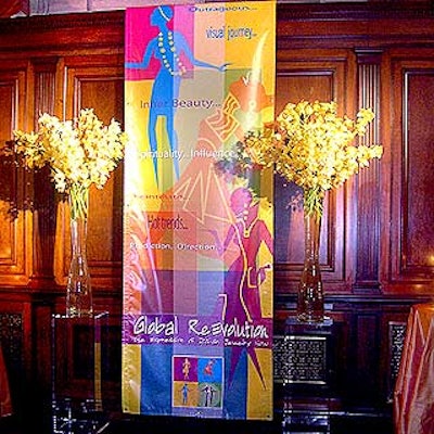 Cocktails were served in the candlelit balcony, which was decorated with tall vases of flowers and colorful banners.