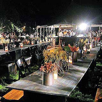 At The Village premiere party in Brooklyn's Prospect Park, rows of long tables paired with mismatched chairs and benches served as the dining area for the pre-screening buffet dinner. Flowers, Sticks and Stones decorated tables with rustic cans and watering pots filled with flowers and herbs.