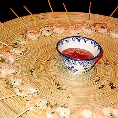 Guests sampled KMG Marketing's bite-sized treats from bamboo trays.
