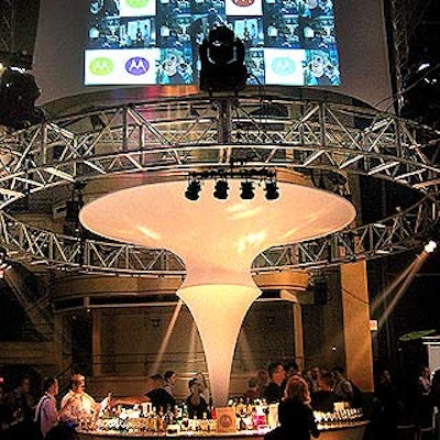 At Motorola's 2004 holiday product launch event at the Hammerstein Ballroom, guests walked into the space and found a large, circular bar as the centerpiece. It featured more than just stemware and spirits: Motorola's sleek new RAZR V3 mobile phones were also on display in the center.