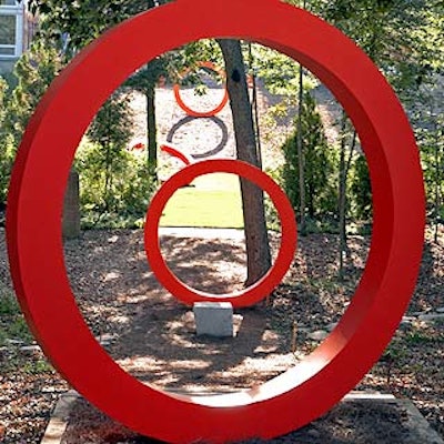 Artists-in-residence worked with Robert Wilson and positioned red circles amid the woods at the Watermill Center. (Photo by Laurie Lambrecht)