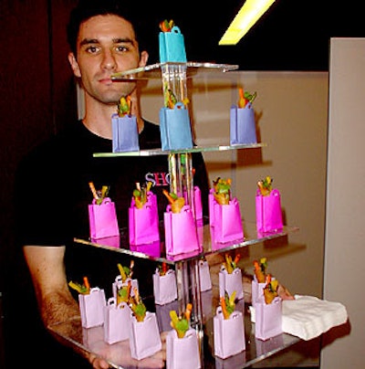Caterer Peter Callahan of Callahan Catering fully embraced the shopping vibe, sending forth food tucked into miniature shopping bags (that confused guests kept attempting to eat). (Photo by Jim Shi)