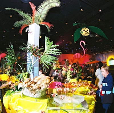 The tropical-themed buffet table presented many tasty items for guests to enjoy.