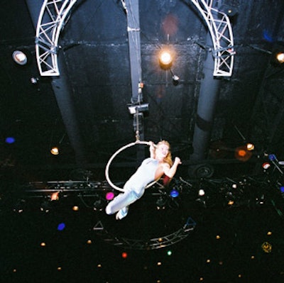An aerialist performed with grace and style on nothing more than a thin hoop that hung from the ceiling of A La Carte Pavilion.