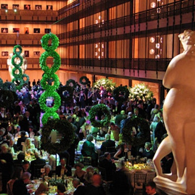 Towering structures of stacked laurel wreaths designed by Avi Adler dominated the Grand Promenade at the New York State Theater for the opening night performance of the New York City Opera's production of Daphne.