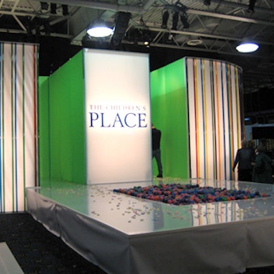 Showman Fabricators built a stark, white open square runway made of white acrylic and striped with color tubes usually used as gels for florescent lights. A pit full of colorful plastic balls filled the center of the runway.