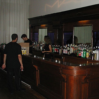 Lighting designed by Frost Lighting projected the MAC logo on the wall behind the bar at Lil' Kim's record release party, which was sponsored by Martell and Heineken.