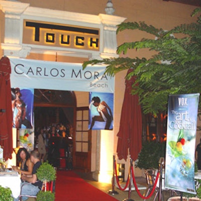 Banners adorned the entrance to Touch for the Carlos Mora fashion show and The Art of the Cocktail book launch. Photo by Olga Goldovskaya.