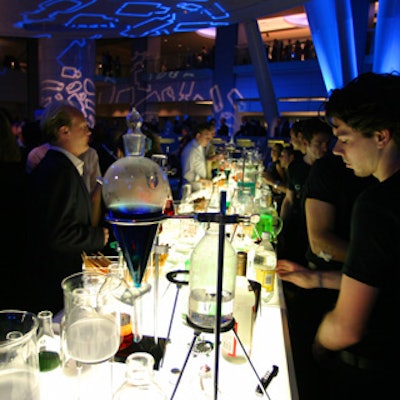 Johnny Hardesty designed a laboratory-theme bar with beakers, flasks, and other scientific equipment for Coty Cosmetics' 100th anniversary event at the Rose Center for Earth and Space.