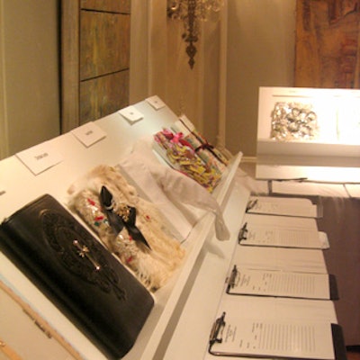 For Paper magazine's 20th anniversary party and auction at the Ukrainian Institute of America, set design company House of Schwartz built elegant, easel-like white wooden tables to display the 100 custom-made book jackets.