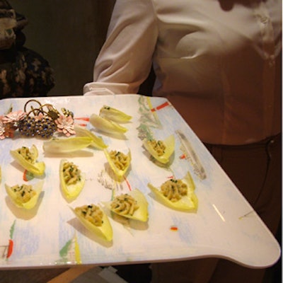 Match served hors d'oeuvres on vintage-looking catering trays accented with bejeweled shower curtain hooks and napkin rings by Cath Kidston.