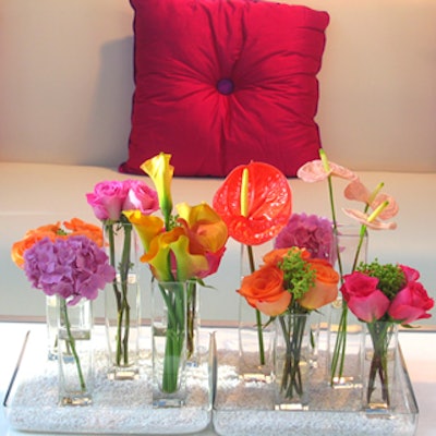 Colourful arrangements of blooms punctuated the bursts of colour introduced by the throw pillows.