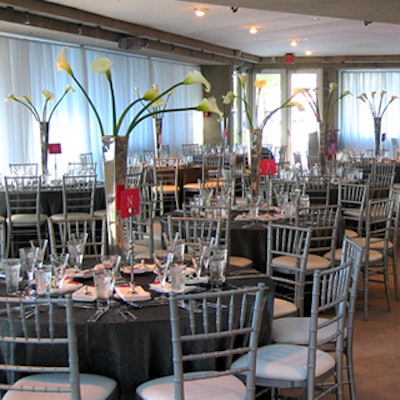Soaring calla lily centerpieces added height to the tables.