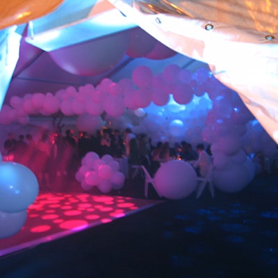 Guests entered the tent on Governors Island to a space lit with moody blue light by Lux Lighting.